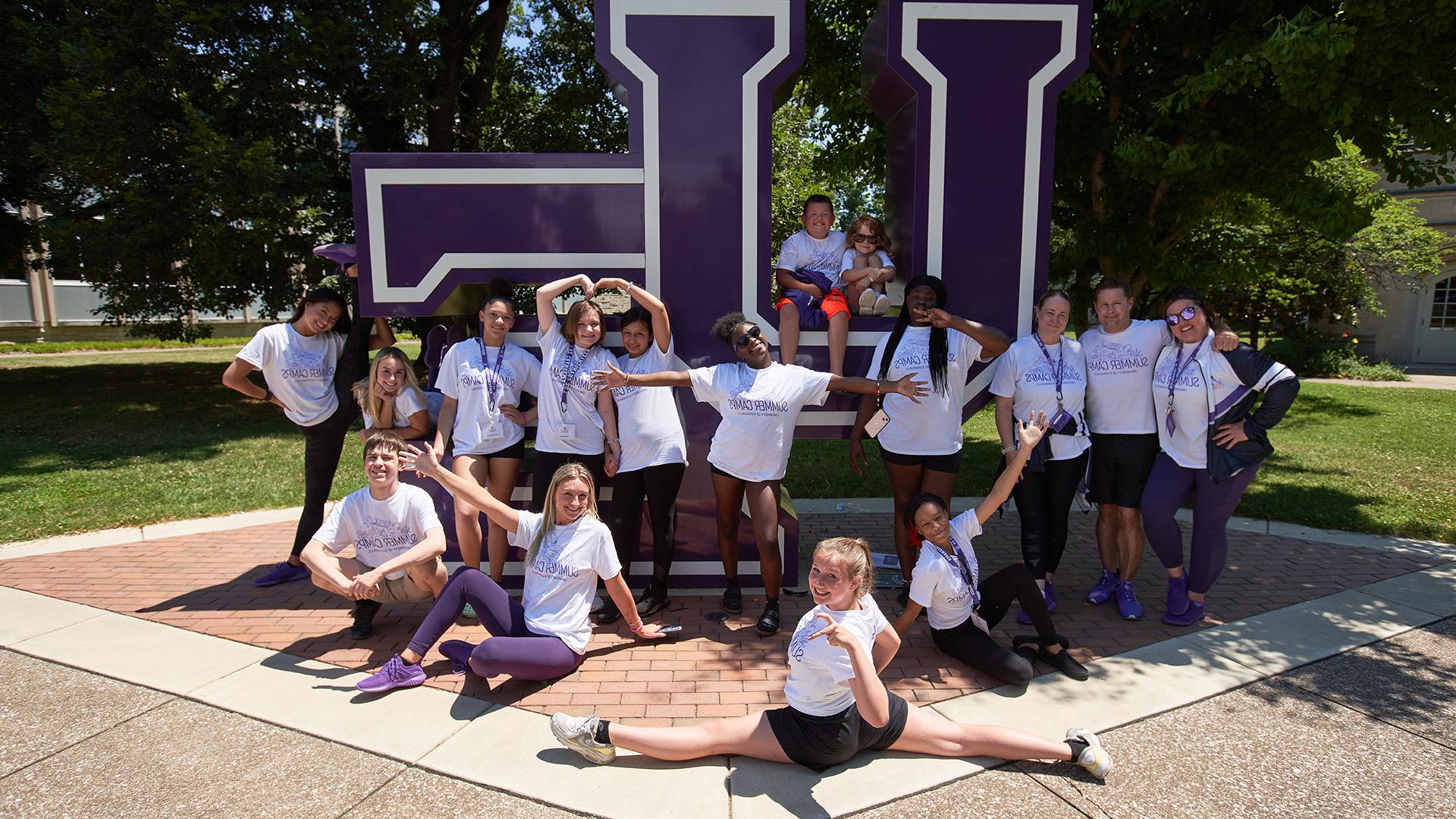 Dance Camp students at UE letters sign