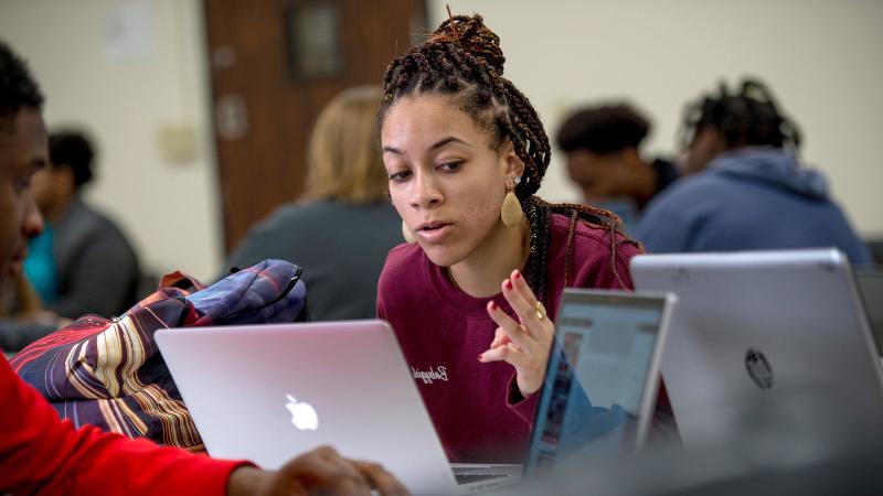 Social Justice student using laptop